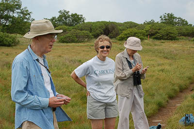 A group of people in a field

Description automatically generated